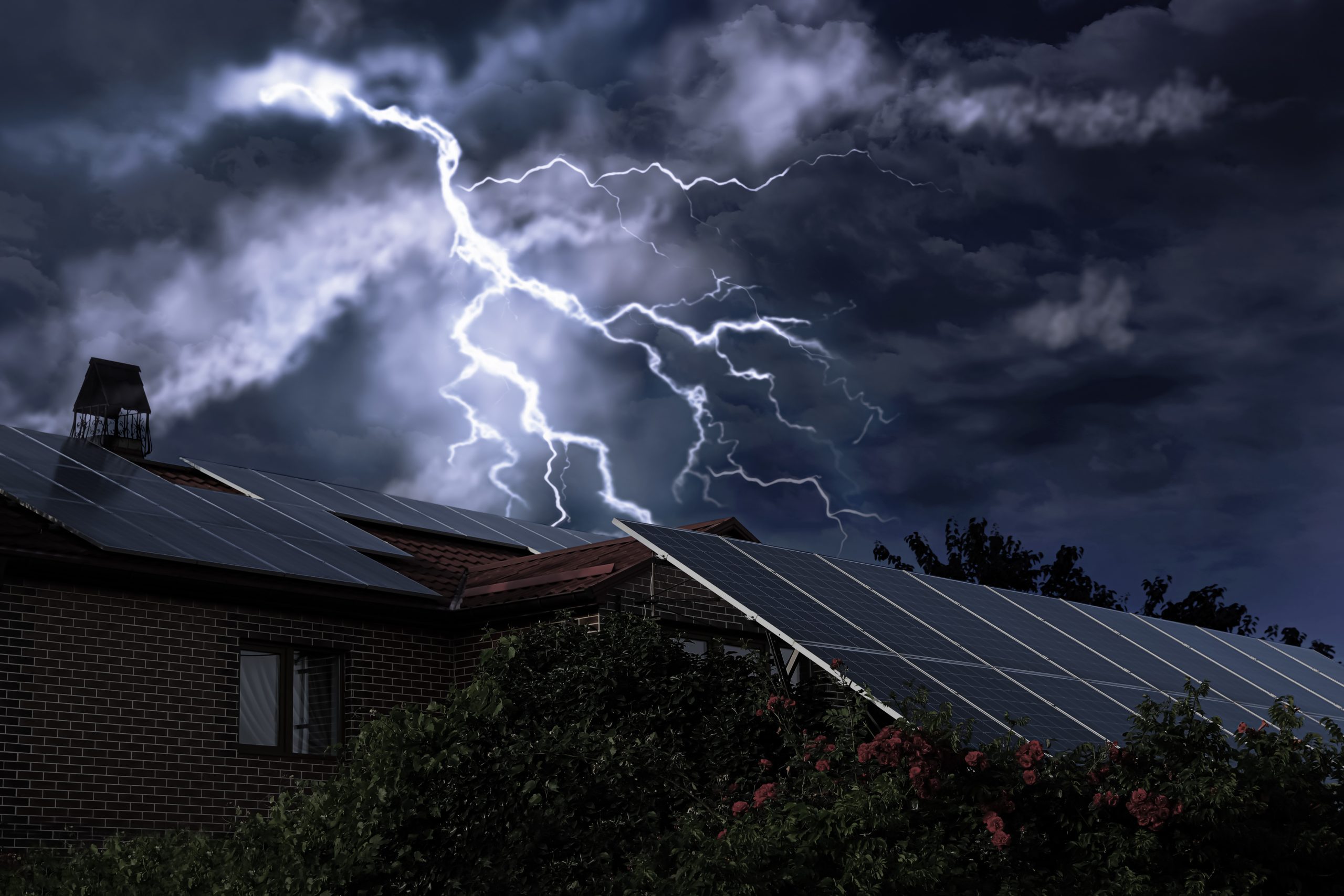 Dark cloudy sky with lightning over house. Stormy weather